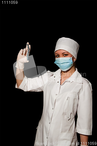Image of young pretty surgeon holding plate for osteosynthesis