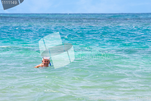 Image of Senior Citizen Snorkeling in Tropical Waters