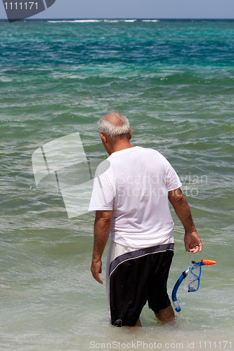 Image of Senior Citizen Snorkeling in Tropical Waters