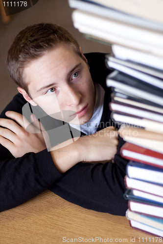 Image of Stressed Student Looks At Books