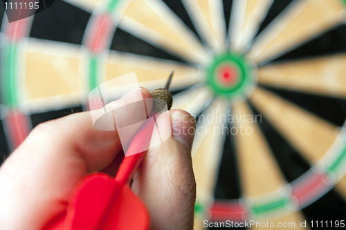 Image of Hand Holding a Dart