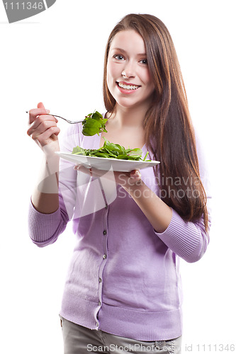 Image of Woman eating salad