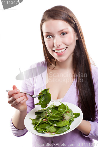 Image of Woman eating salad