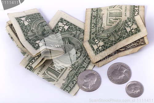 Image of last money, small dollar banknotes and coins.