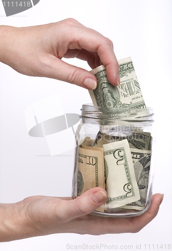 Image of money in the glass jar