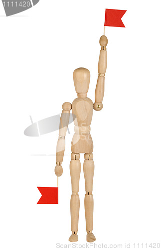 Image of wooden toy man with red flags