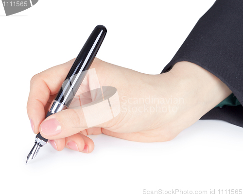 Image of Female hand holds pen