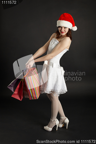 Image of Happy girl with Christmas gifts