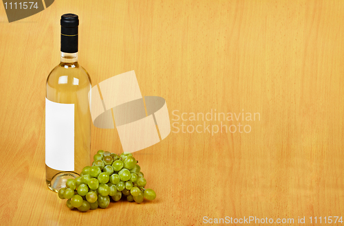 Image of Open arrangement of bottle of white wine