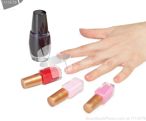 Image of Female hand and choice of color nail polish