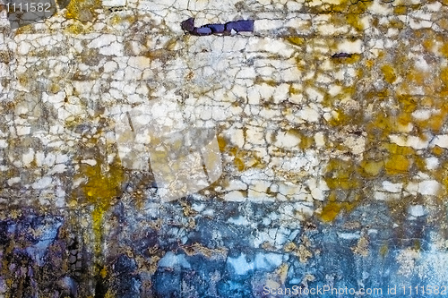 Image of Old concrete wall with spots and cracks