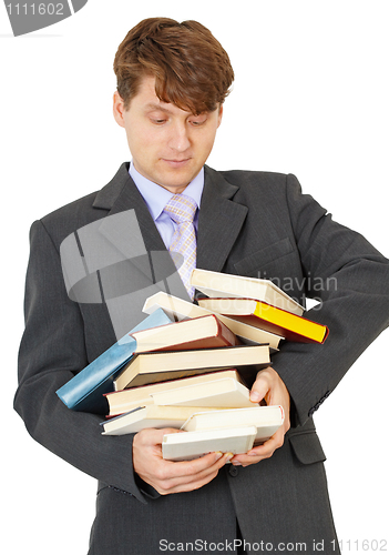 Image of Student bears big pile of textbooks in hands