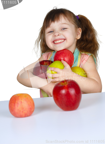 Image of Happy little girl with apples