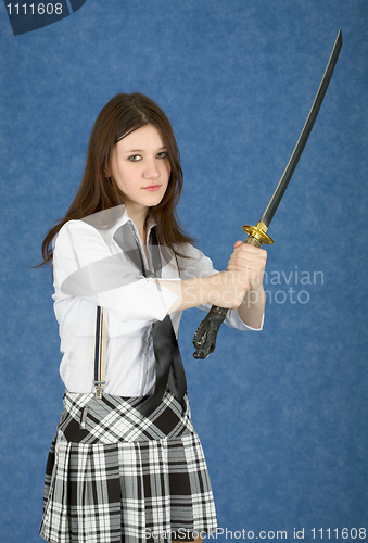 Image of Girl - teenager menacingly brandishes a sword