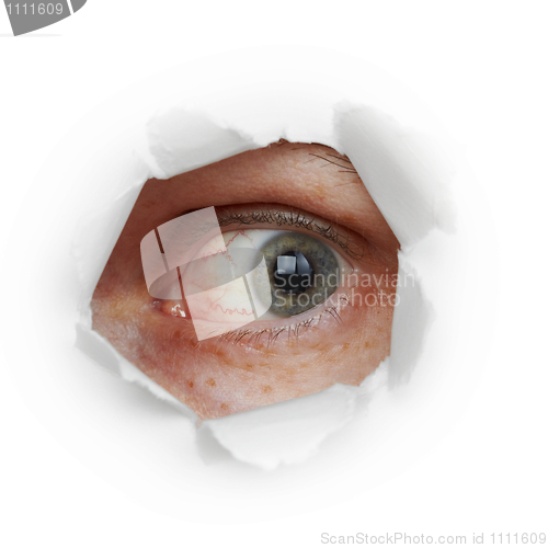 Image of Human eye looks through hole