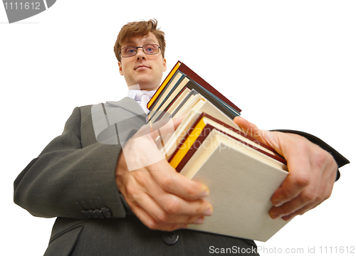 Image of Young man with pile of books in hands