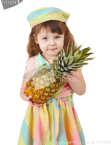 Image of Sad little girl holding large pineapple