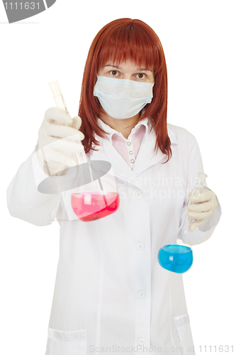 Image of Female scientist offers red bulb