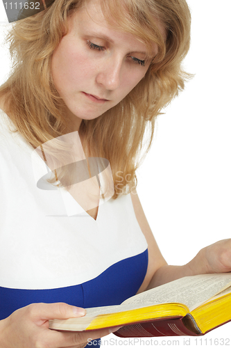 Image of A woman reads a book close-up on white