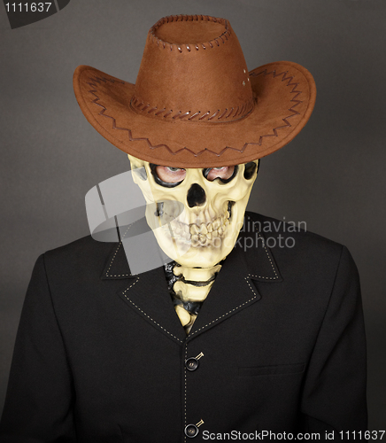 Image of Man - skeleton in leather cowboy hat