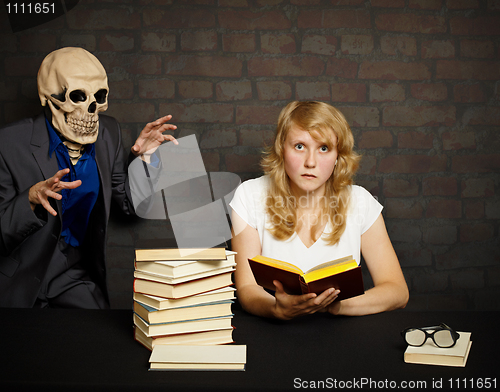 Image of Woman reads a scary books
