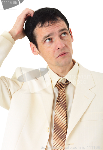 Image of Puzzled man scratches his head, isolated on white