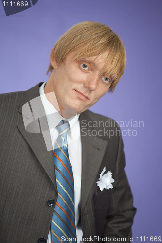 Image of Portrait of young man - groom on violet