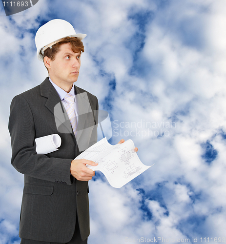 Image of Engineer - builder on background of cloudy sky