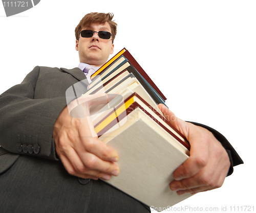 Image of Man in dark glasses holding a books