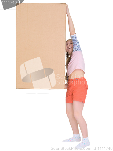 Image of Small cheerful girl drags big cardboard box isolated on white