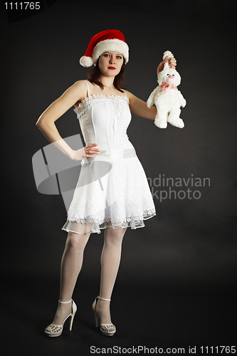 Image of Girl in white dress holding white rabbit