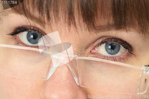 Image of Women look over spectacles close up