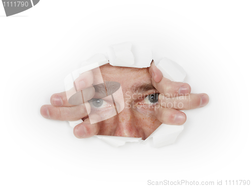 Image of Man looks out from hole in white paper