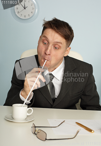 Image of Comic man drinking coffee with long straws