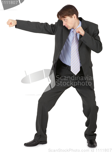 Image of Man in black suit, punching