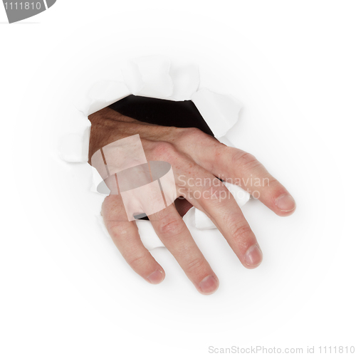 Image of Hand breaks through white paper