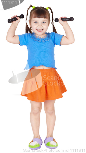 Image of Athletic child is doing dumbbell