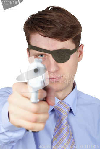 Image of Portrait of young guy with eye-patch shooting a pistol