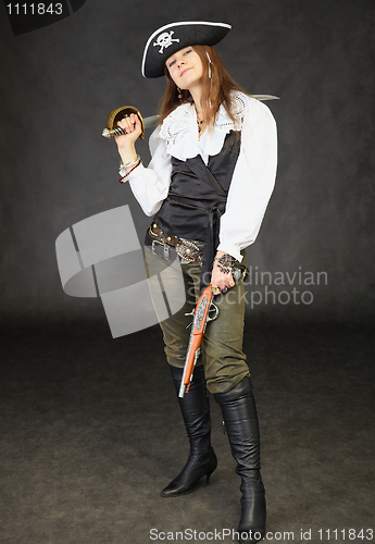 Image of Girl dressed as pirate on black with sword