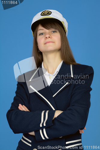 Image of Portrait of the proud woman - captain on blue