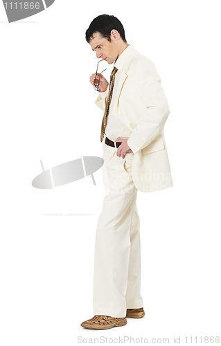 Image of Thoughtful man in white business suit