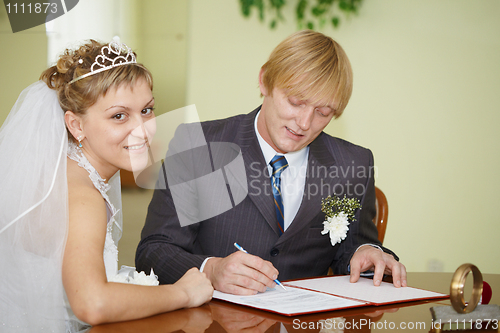 Image of Registration of marriage. Happy newlyweds.