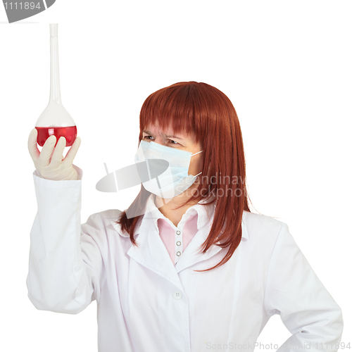 Image of Woman - scientist studying chemical solution