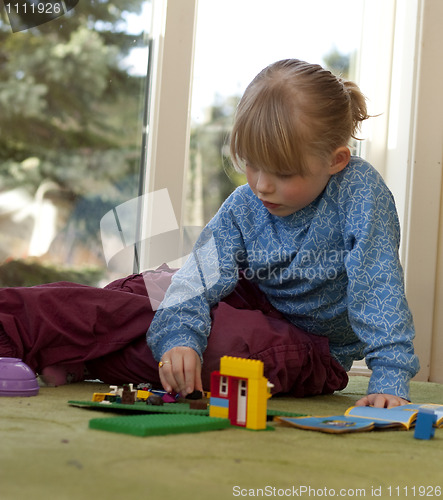 Image of Child playing with bricks