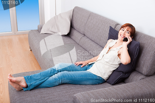 Image of Woman talking on phone