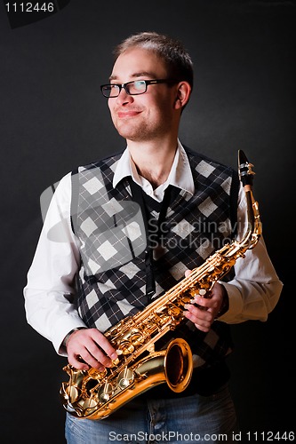 Image of man and saxophone