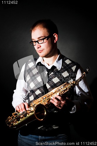 Image of man and saxophone