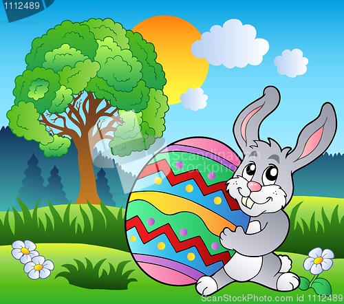 Image of Meadow with tree and Easter bunny