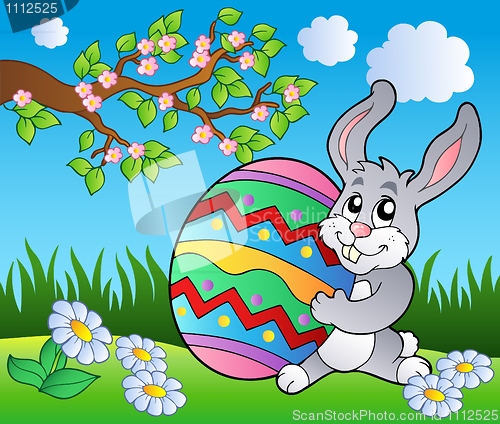 Image of Spring meadow with bunny and egg