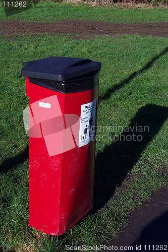 Image of poop bin in a park